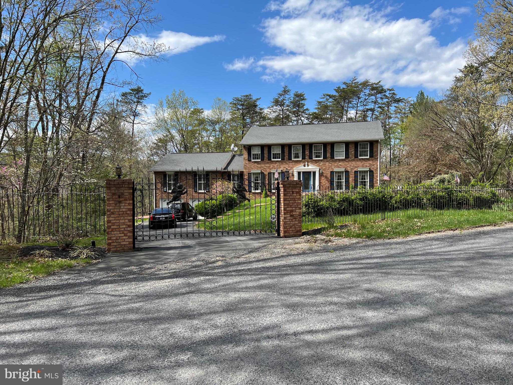 a view of a house next to a yard