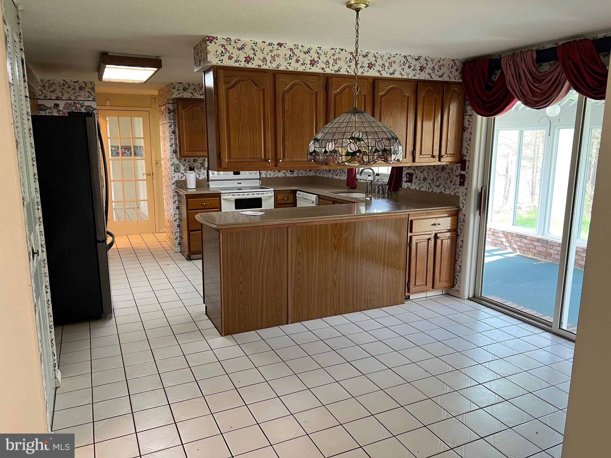 17702 Maniford Road Southeast Oldtown, MD 21555 - Photo 15 of 46 a kitchen with stainless steel appliances granite countertop a stove a refrigerator a sink and dishwasher