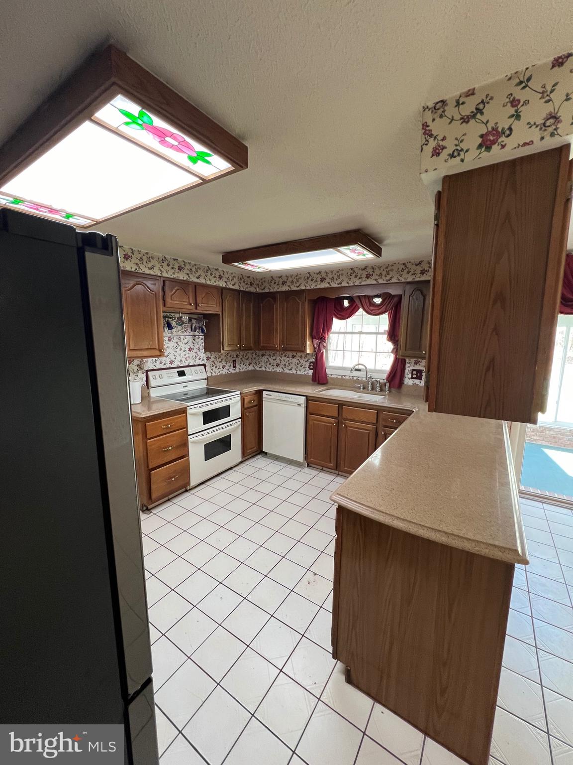 17702 Maniford Road Southeast Oldtown, MD 21555 - Photo 17 of 46 a kitchen with a sink a stove and refrigerator
