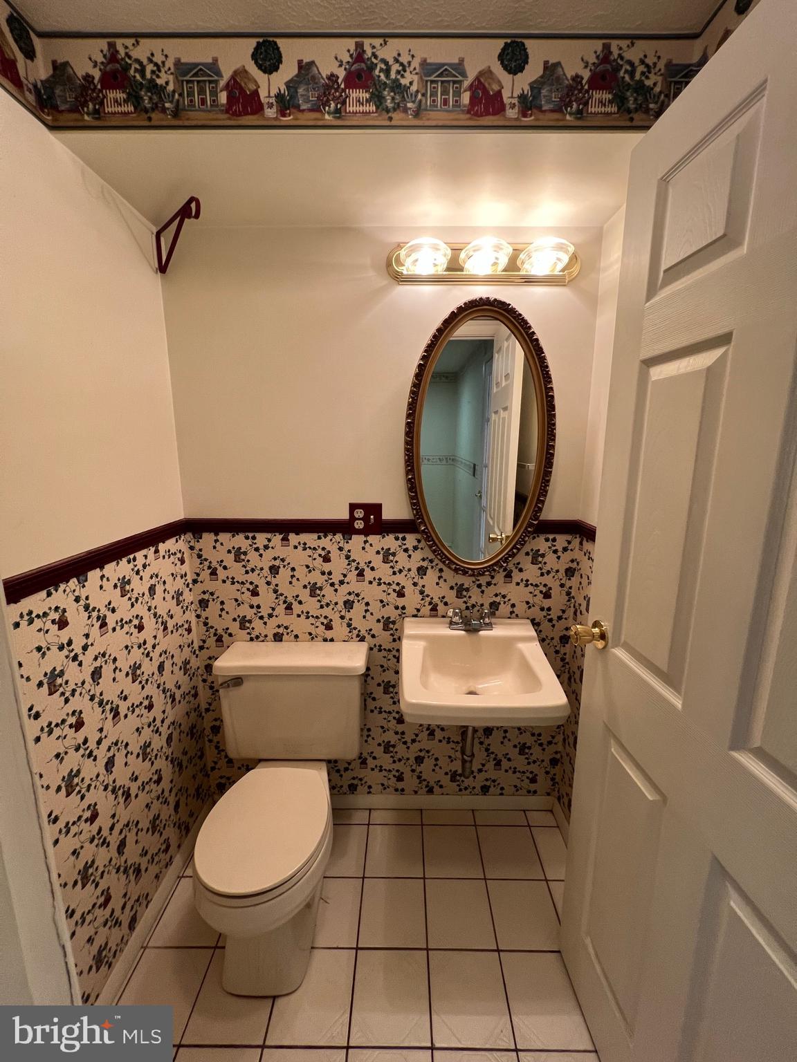 17702 Maniford Road Southeast Oldtown, MD 21555 - Photo 18 of 46 a bathroom with a toilet mirror and vanity