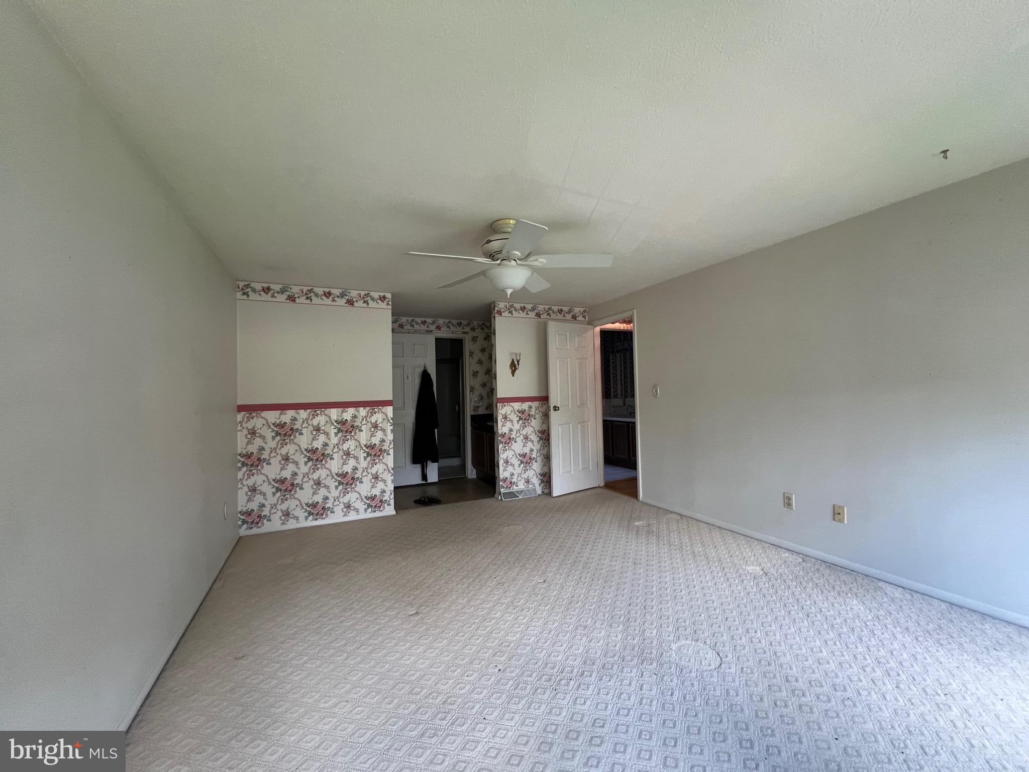 17702 Maniford Road Southeast Oldtown, MD 21555 - Photo 35 of 46 an empty room with chandelier fan
