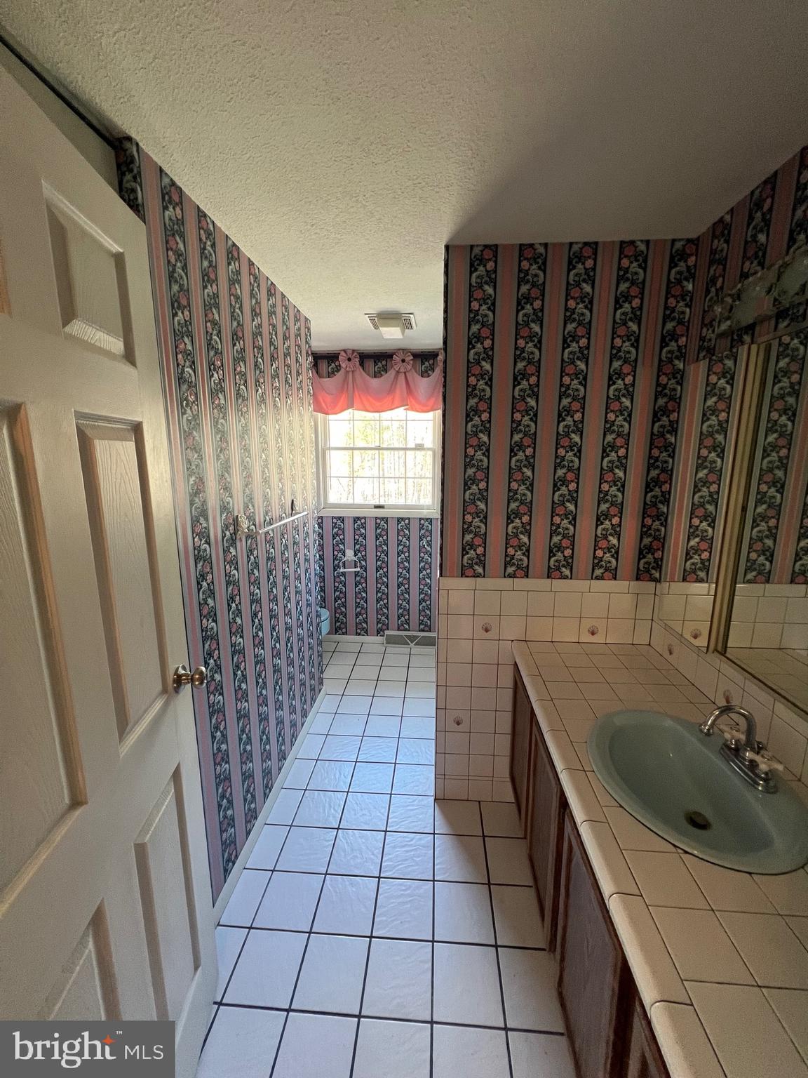 17702 Maniford Road Southeast Oldtown, MD 21555 - Photo 39 of 46 a bathroom with a sink a toilet and shower