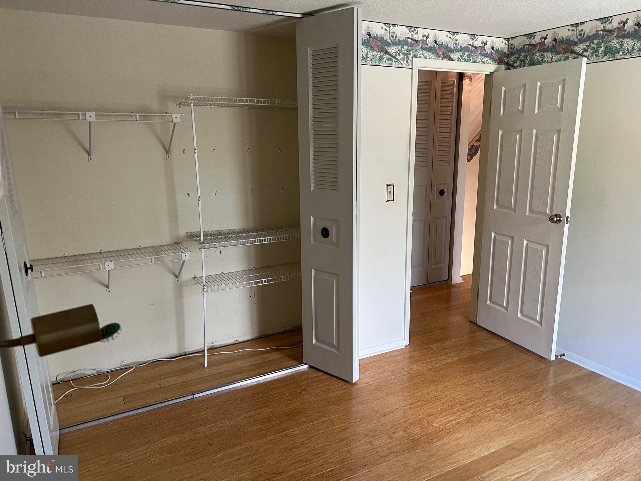 17702 Maniford Road Southeast Oldtown, MD 21555 - Photo 42 of 46 a view of a walk in closet with wooden floor