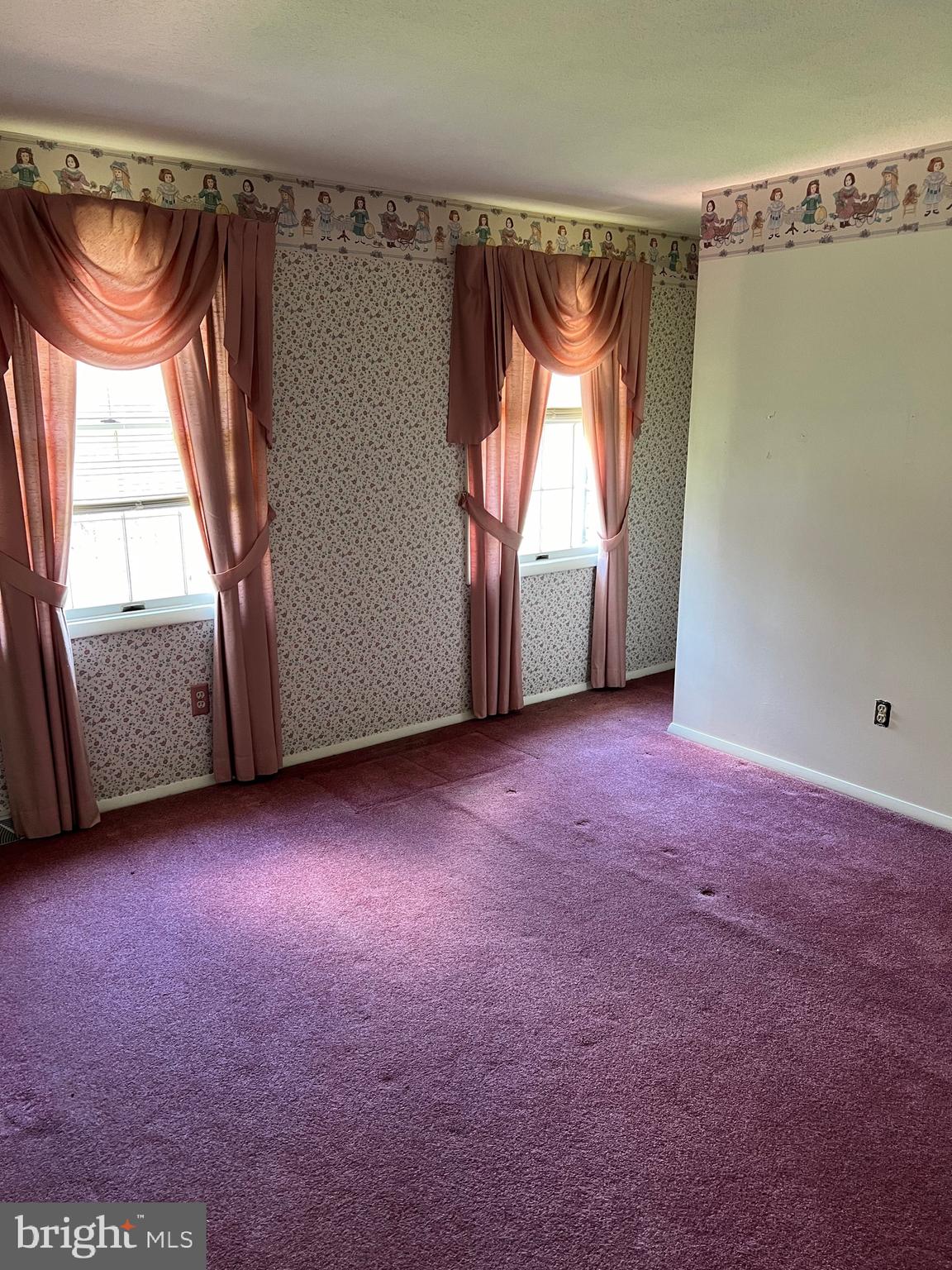 17702 Maniford Road Southeast Oldtown, MD 21555 - Photo 43 of 46 an empty room with a fireplace and windows