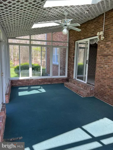 a view of a house with backyard and porch