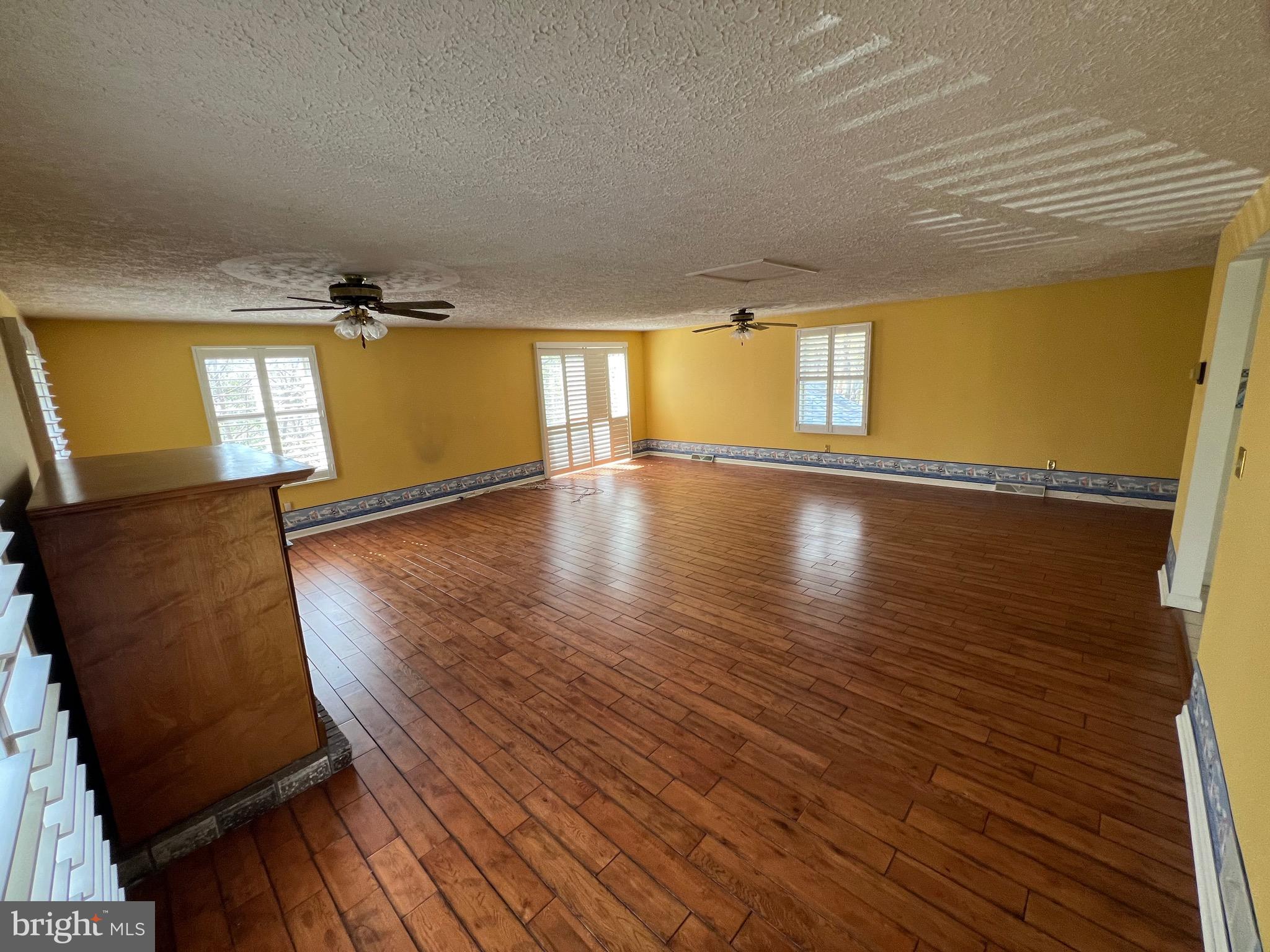 17702 Maniford Road Southeast Oldtown, MD 21555 - Photo 7 of 46 a view of empty room with wooden floor and fan