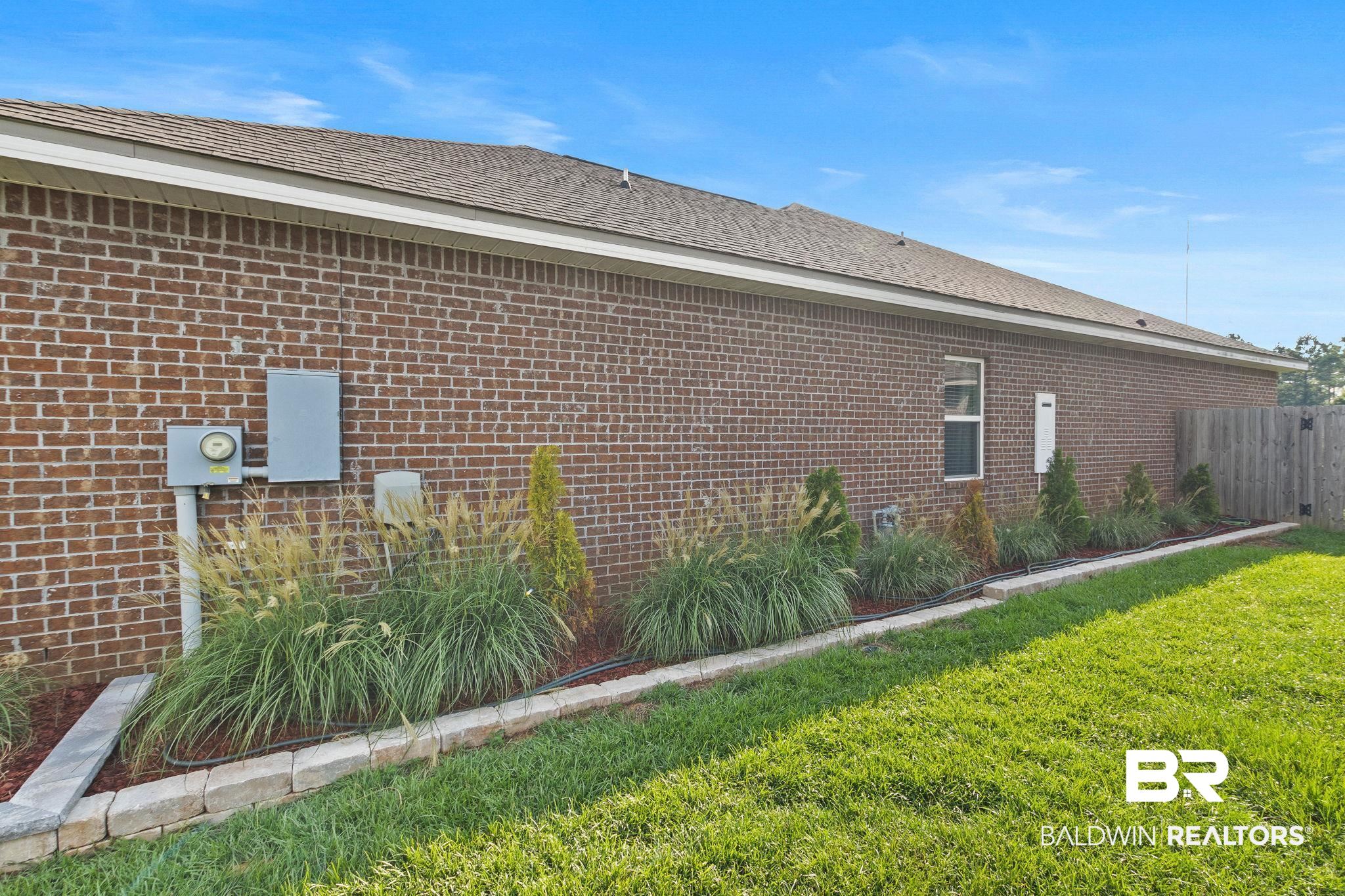 31541 Hoot Owl Road Daphne, AL 36527 - Photo 47 of 51 View of side of property featuring a lawn