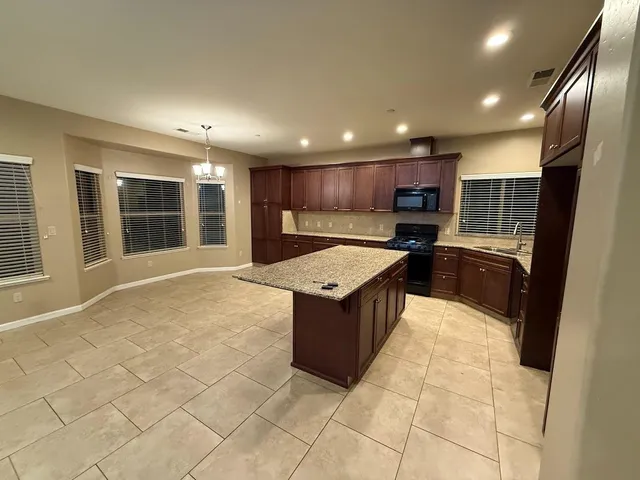 wooden floor in an empty room with a fireplace