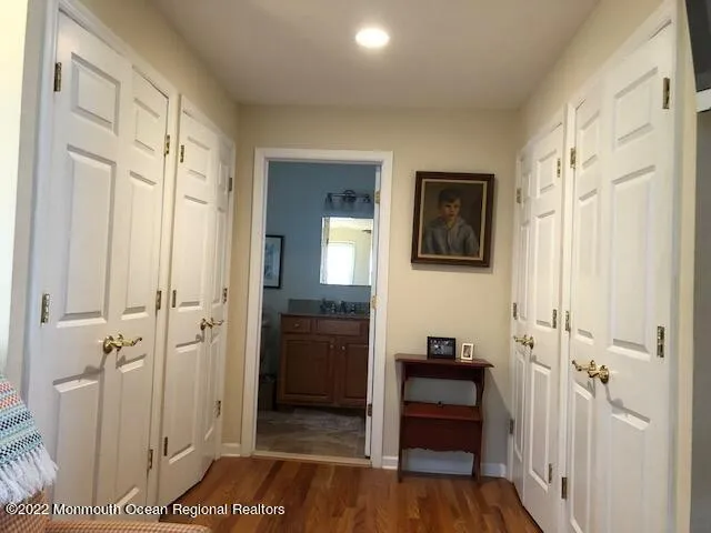 a view of a hallway view with wooden floor and staircase