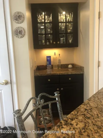 a bathroom with a sink vanity and mirror