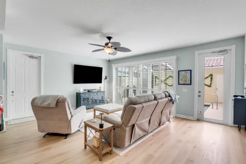 a living room with furniture flat screen tv and a fireplace