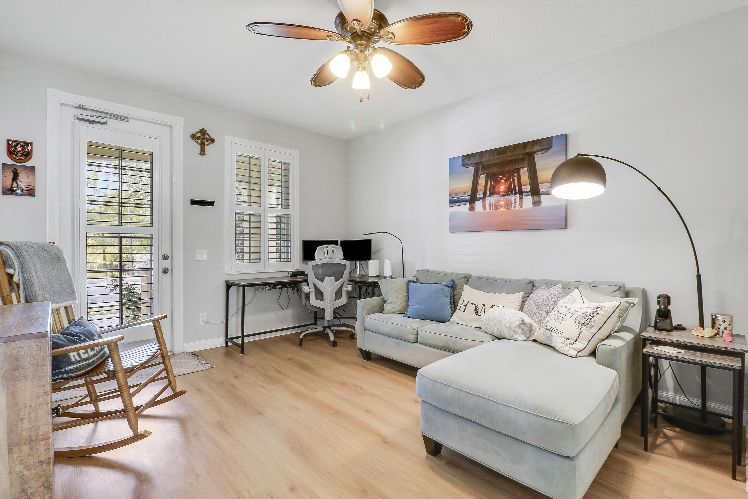 151 Rivinia Drive Jupiter, FL 33458 - Photo 17 of 40 a living room with furniture and a large window
