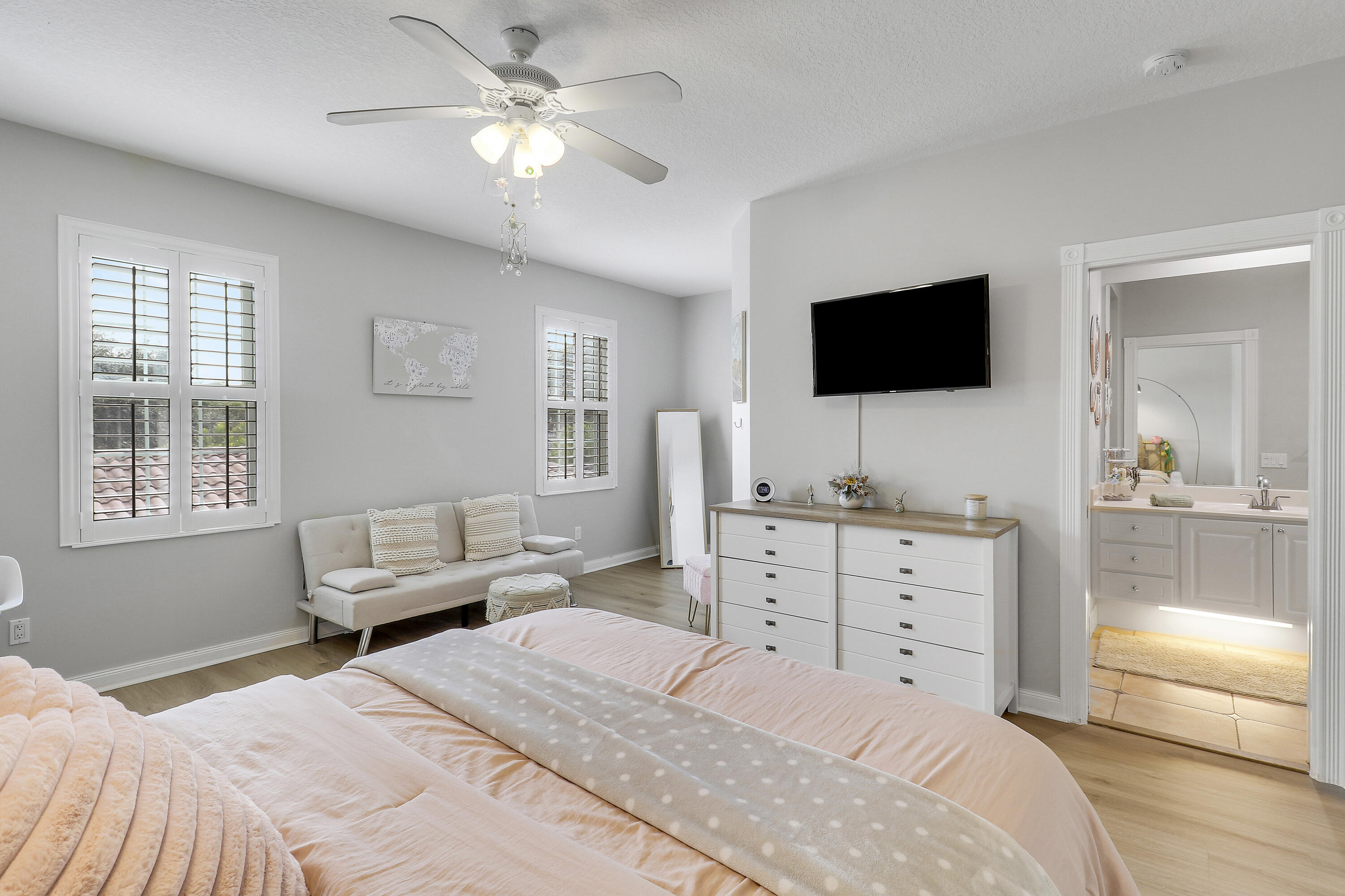 151 Rivinia Drive Jupiter, FL 33458 - Photo 29 of 40 a bedroom with a large bed and a flat screen tv