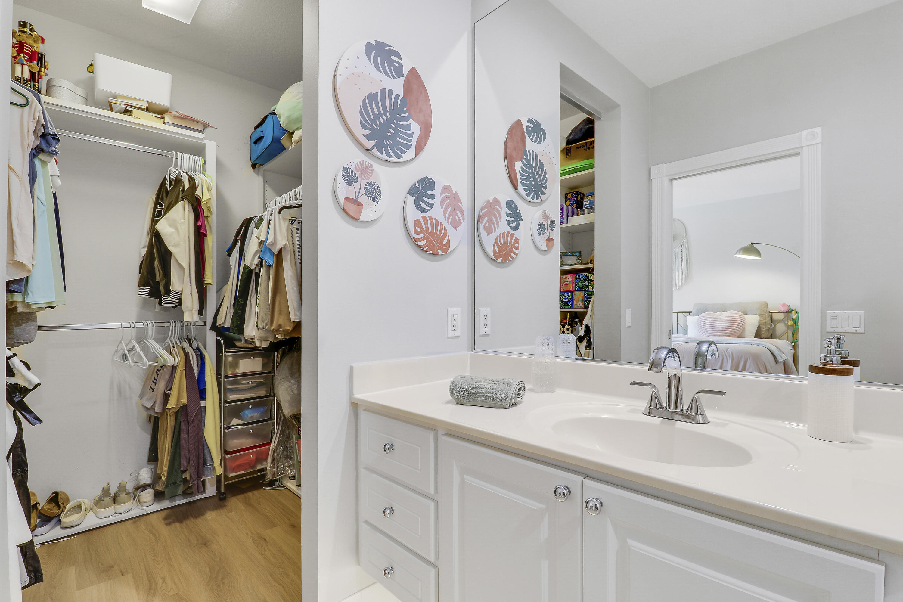 151 Rivinia Drive Jupiter, FL 33458 - Photo 31 of 40 a bathroom with a sink mirror and vanity