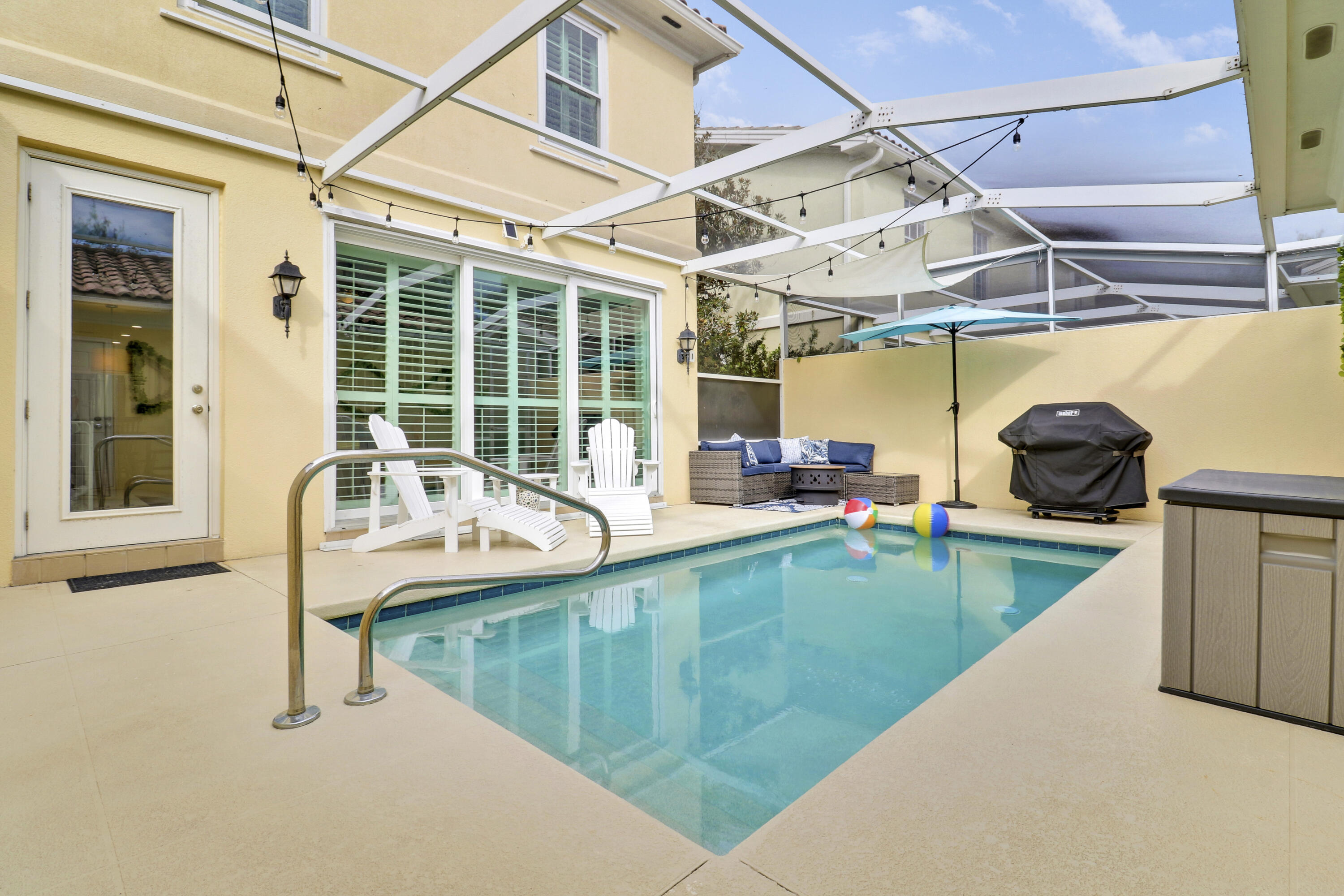 151 Rivinia Drive Jupiter, FL 33458 - Photo 34 of 40 a view of a swimming pool with a sink and couch