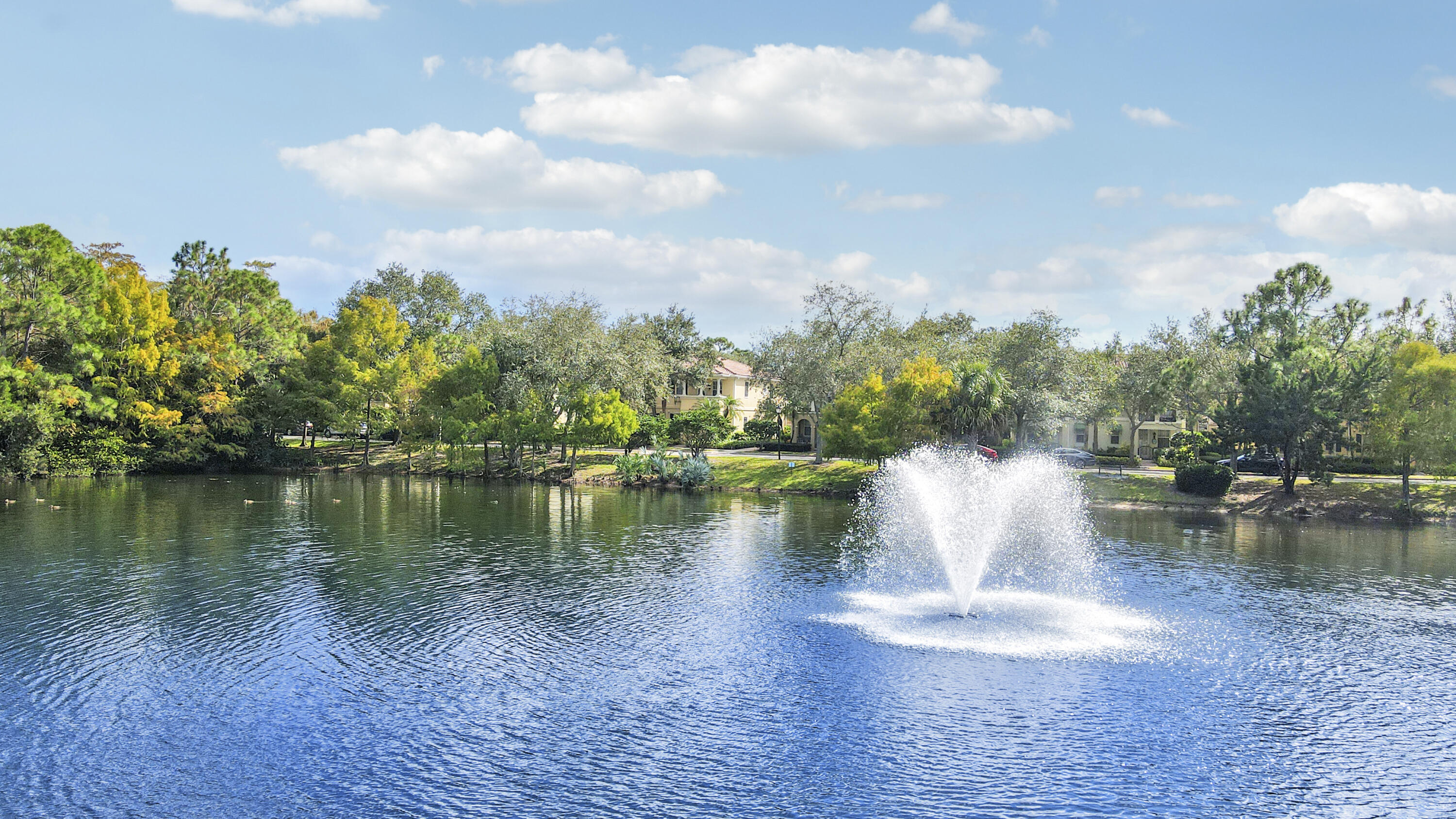 151 Rivinia Drive Jupiter, FL 33458 - Photo 37 of 40 a view of a lake with a yard