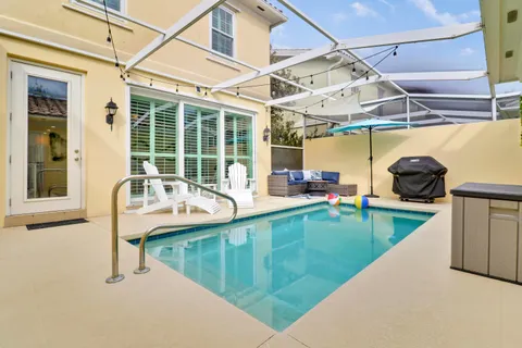 a view of a swimming pool with a sink and couch