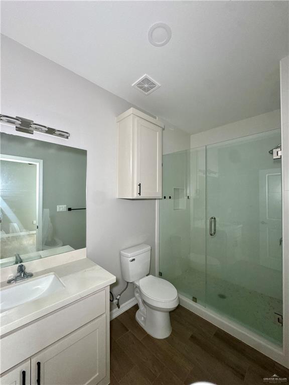 720 Ragland Road, Unit 8 Mission, TX 78572 - Photo 9 of 17 a bathroom with a toilet a sink and shower