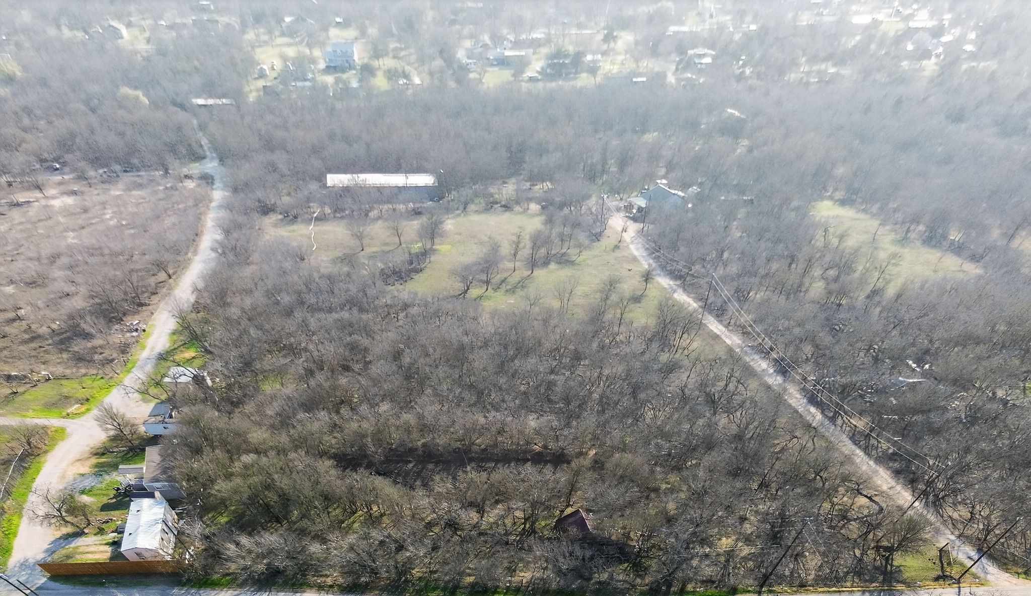 885 Long Hollow Road Dale, TX 78616 - Photo 4 of 14 a view of a refrigerator in a yard