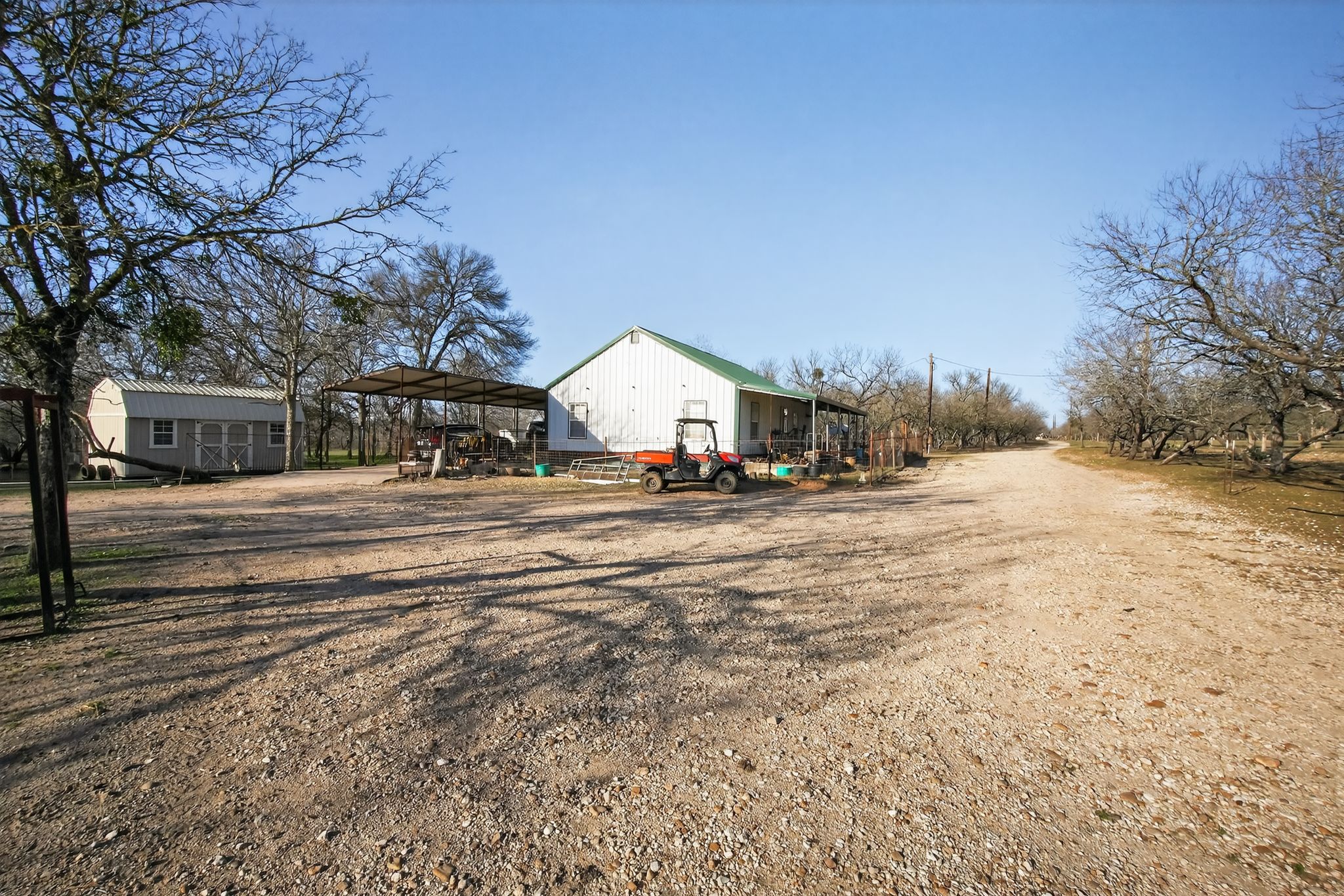 885 Long Hollow Road Dale, TX 78616 - Photo 10 of 14 a view of road with large trees