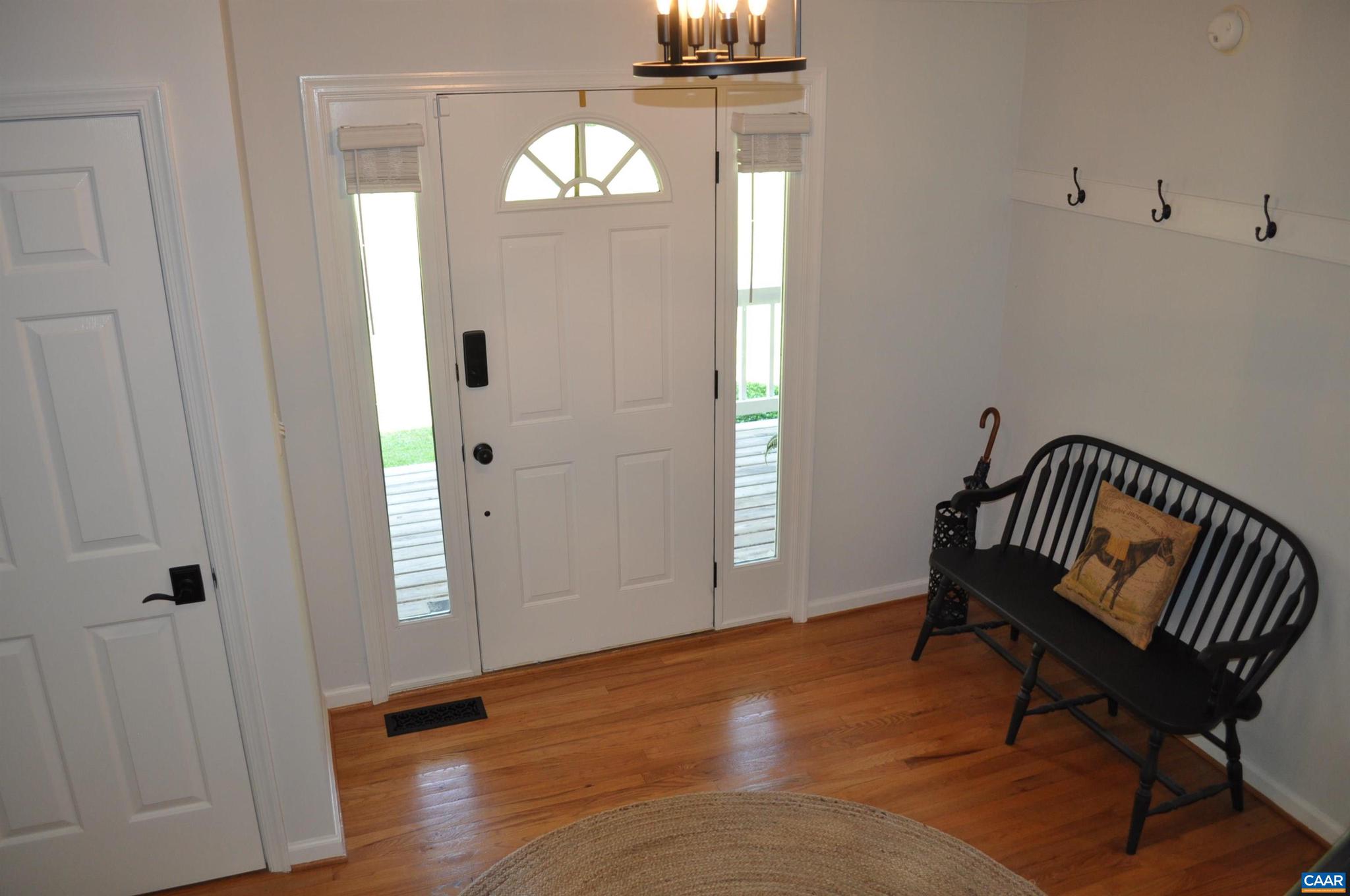 3257 Martin Kings Road Charlottesville, VA 22902 - Photo 5 of 49 an empty room with wooden floor mirror and windows