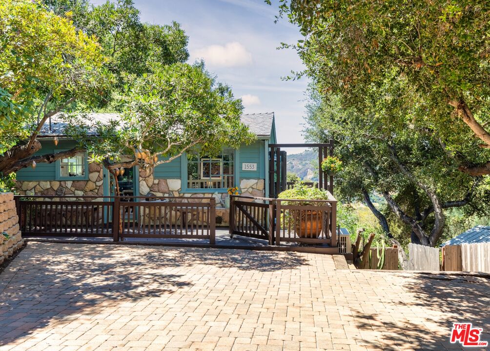 1553 Penny Road Topanga, CA 90290 - Photo 1 of 23 a front view of a house with a yard