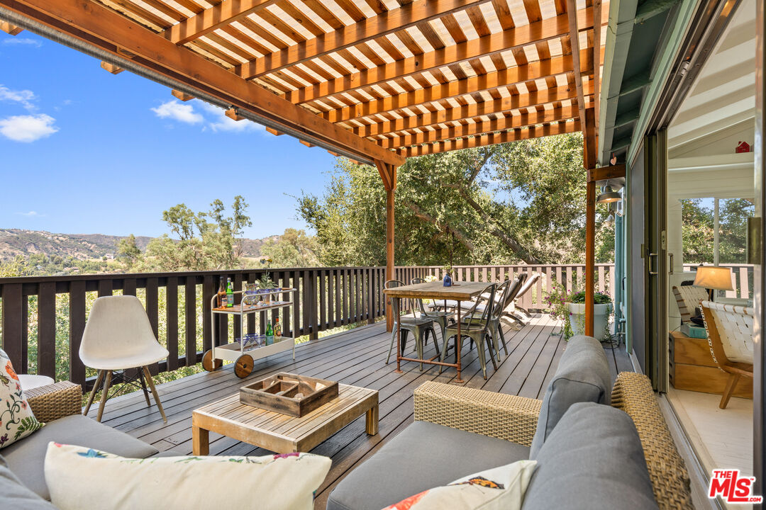 1553 Penny Road Topanga, CA 90290 - Photo 11 of 23 a view of a chairs and table in the balcony