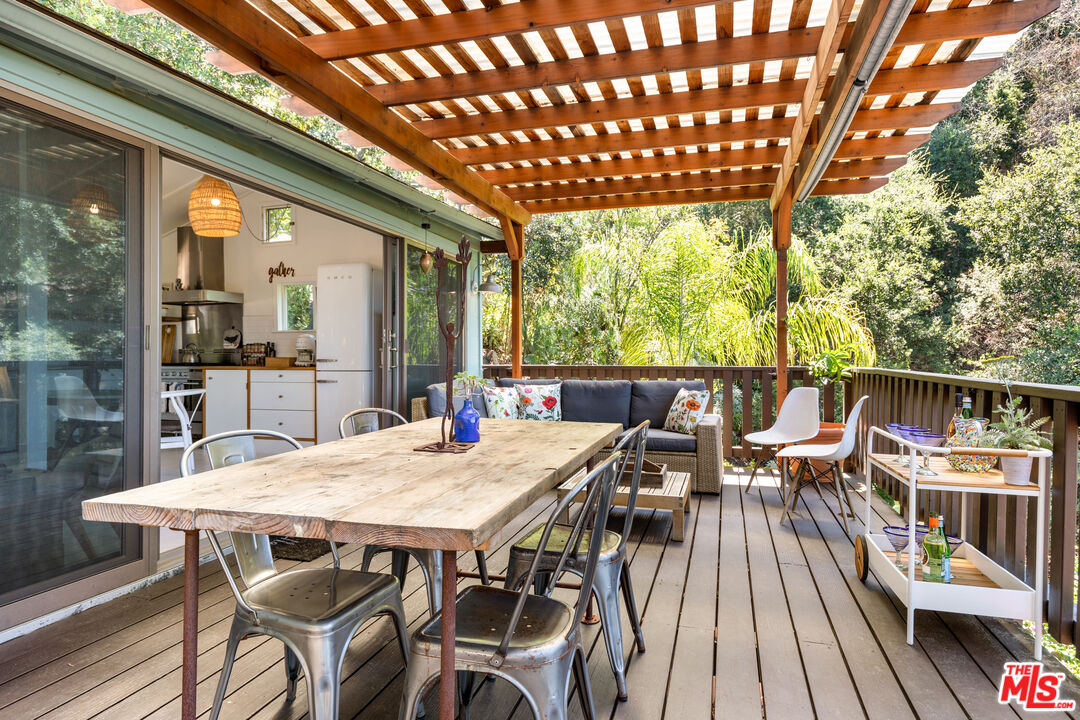 1553 Penny Road Topanga, CA 90290 - Photo 12 of 23 a view of a patio with table and chairs