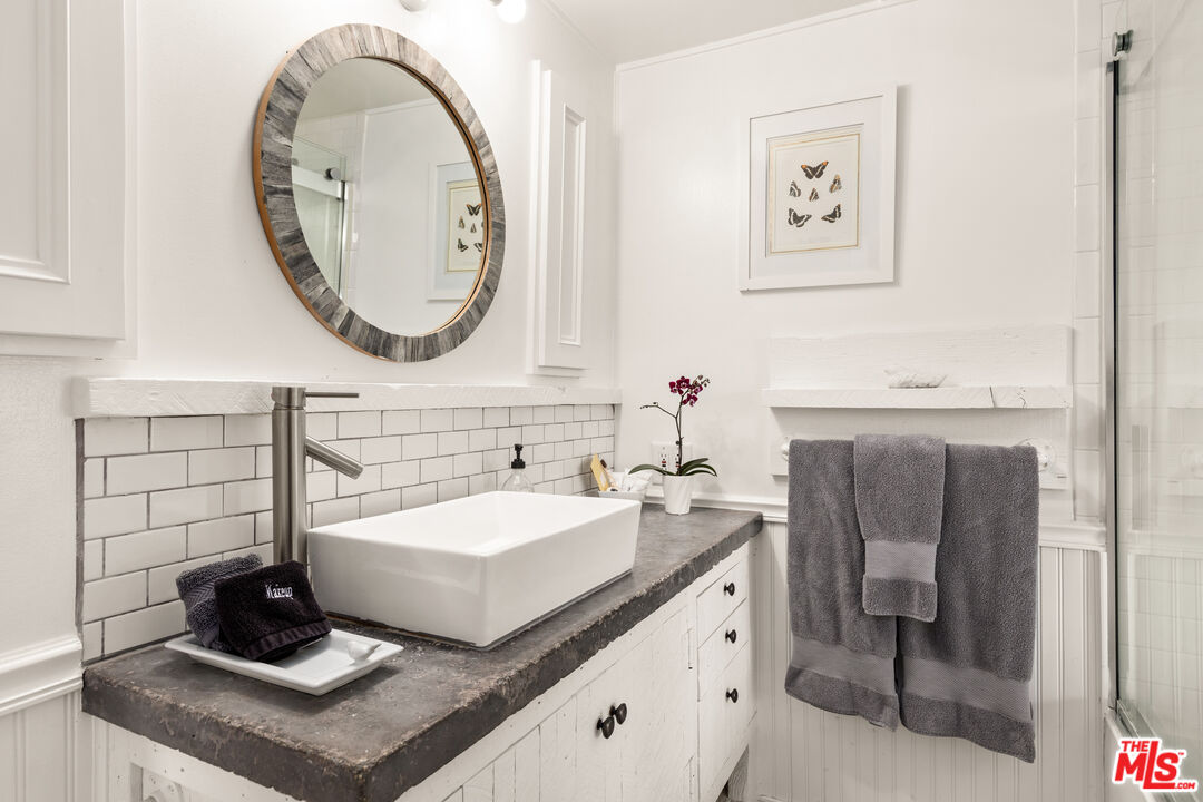 1553 Penny Road Topanga, CA 90290 - Photo 15 of 23 a bathroom with a sink and a mirror