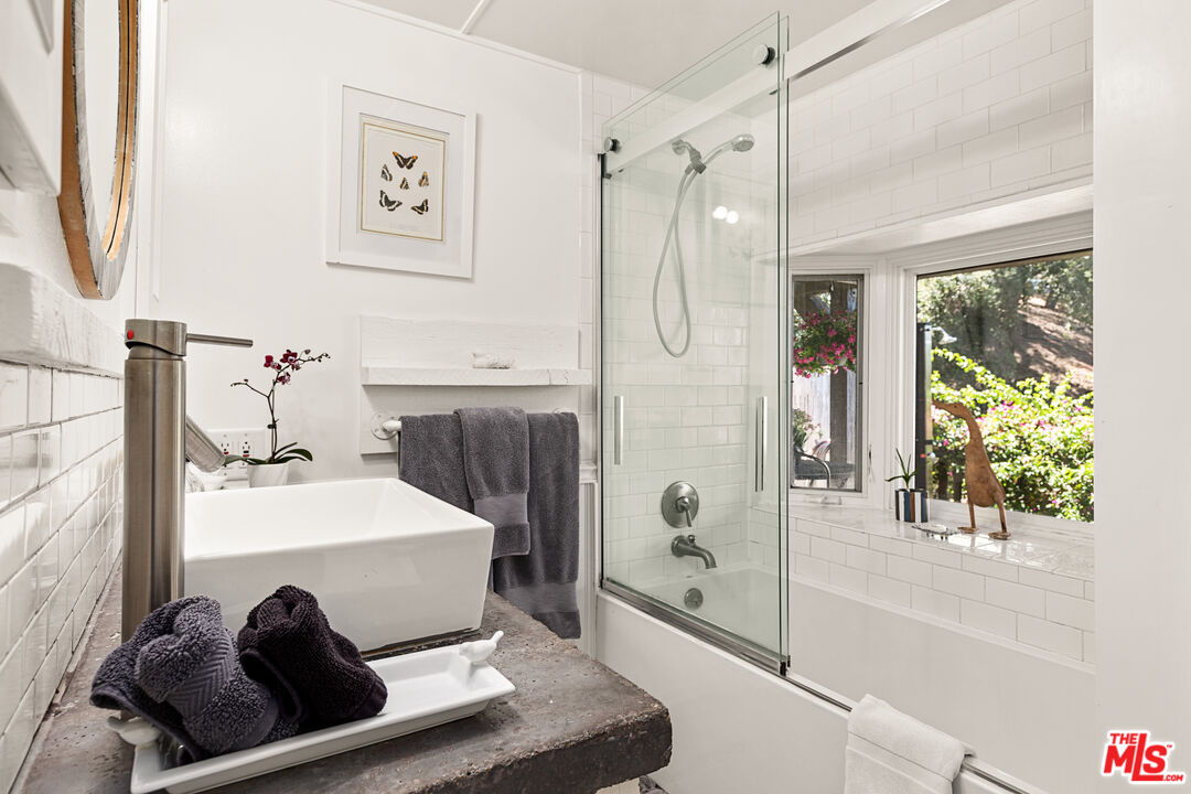1553 Penny Road Topanga, CA 90290 - Photo 16 of 23 a en suite spacious bathroom with a tub shower and window