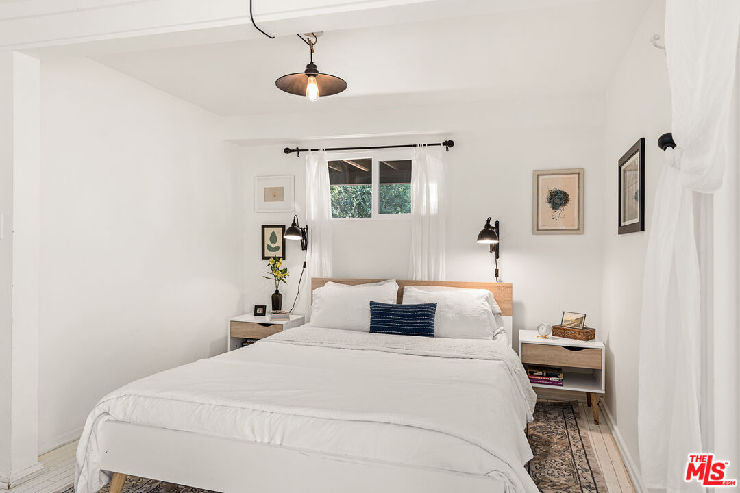 1553 Penny Road Topanga, CA 90290 - Photo 18 of 23 a bedroom with a bed and a window