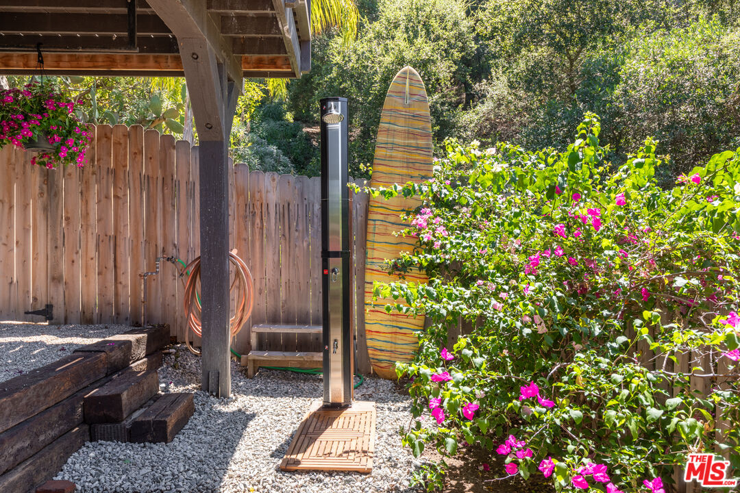 1553 Penny Road Topanga, CA 90290 - Photo 22 of 23 a flower pot with wooden fence