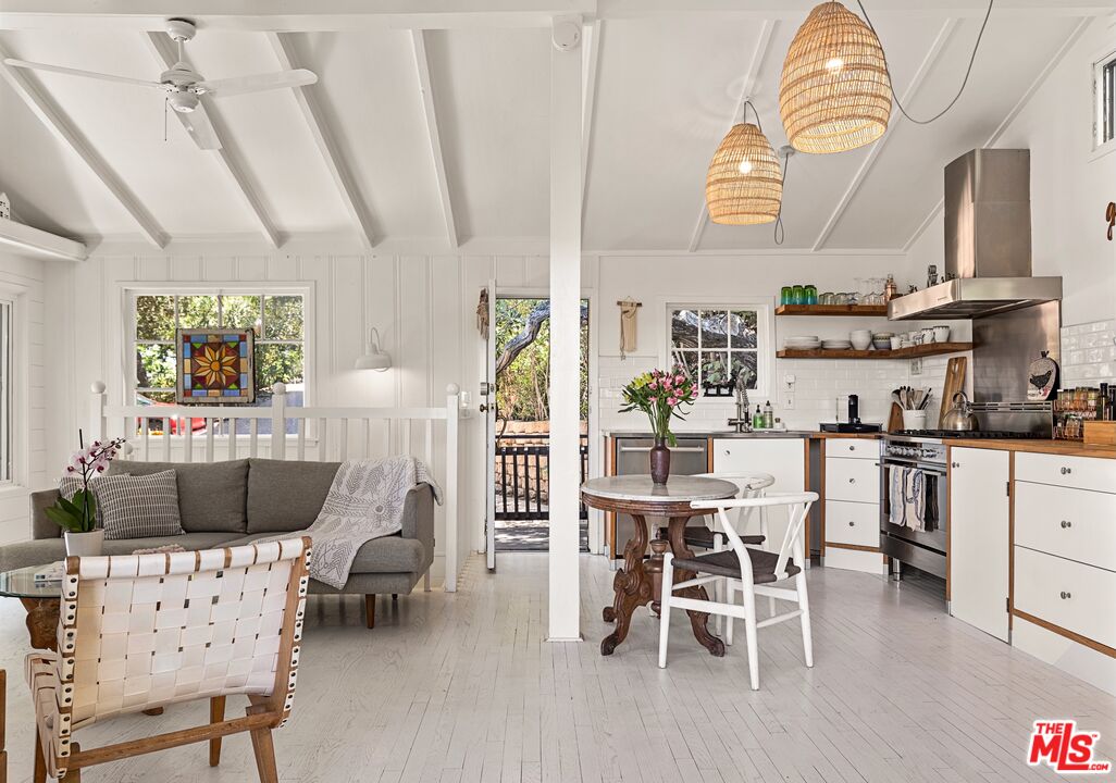 1553 Penny Road Topanga, CA 90290 - Photo 3 of 23 a dining room with furniture and wooden floor