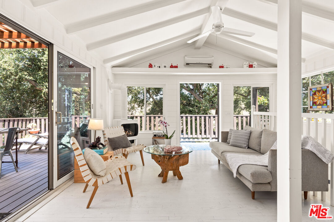 1553 Penny Road Topanga, CA 90290 - Photo 5 of 23 a living room with furniture and a large window with outer view
