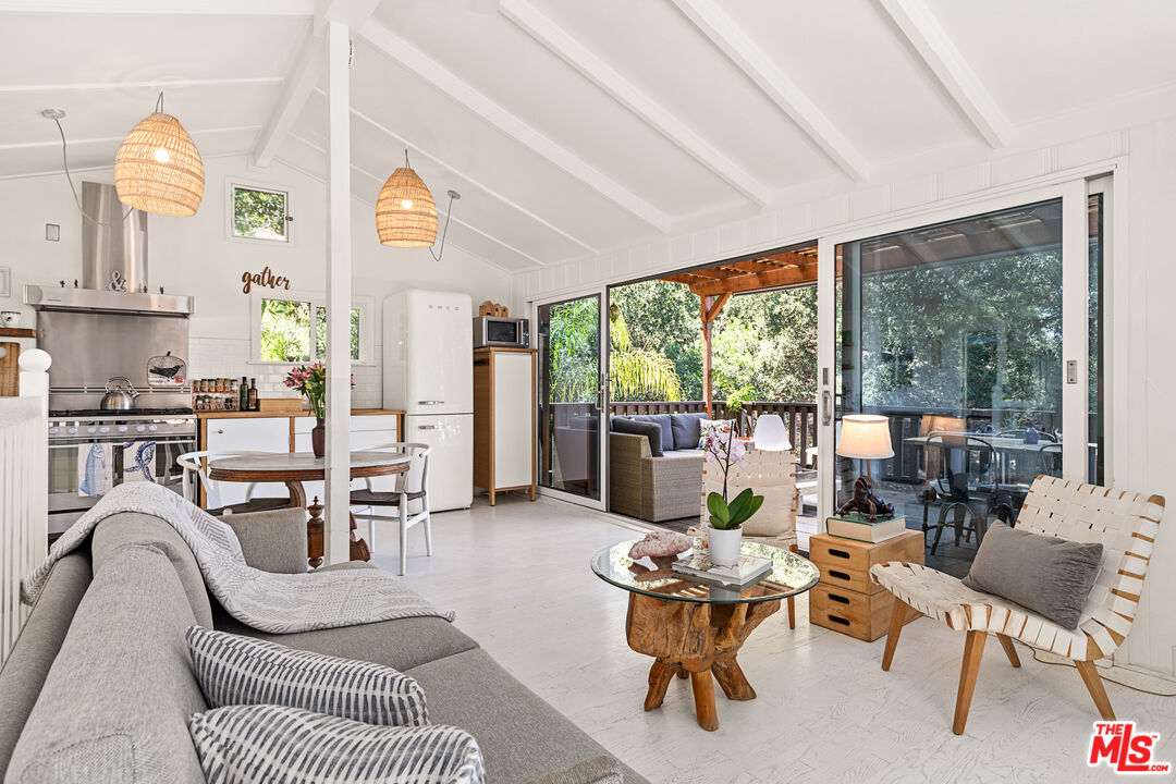 1553 Penny Road Topanga, CA 90290 - Photo 6 of 23 a living room with furniture and a large window