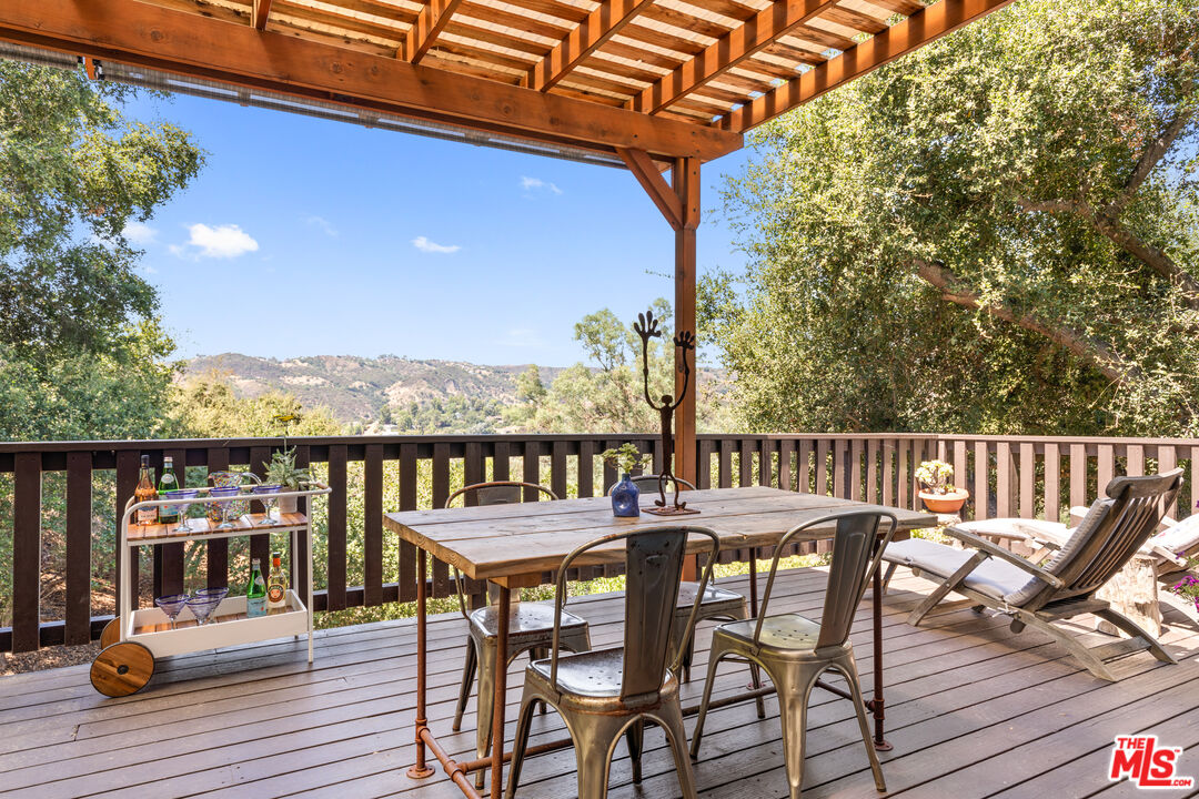 1553 Penny Road Topanga, CA 90290 - Photo 10 of 23 a view of a chairs and table on the wooden floor