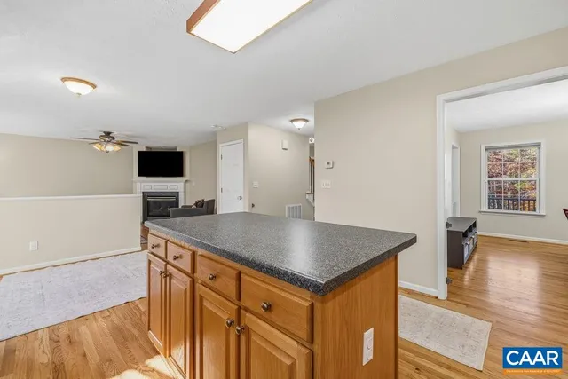 a kitchen with a sink a stove and a refrigerator