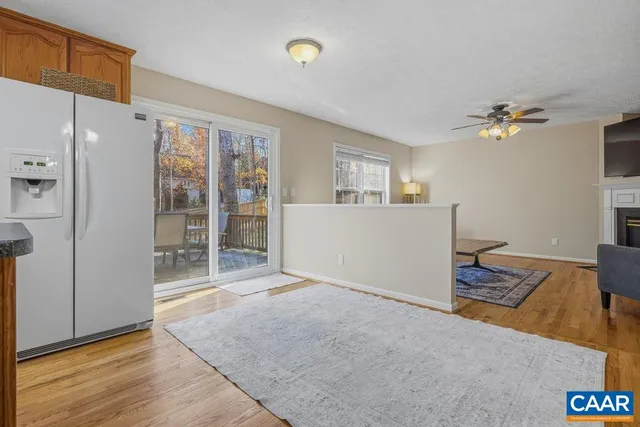 a view of a kitchen with furniture and a ceiling fan