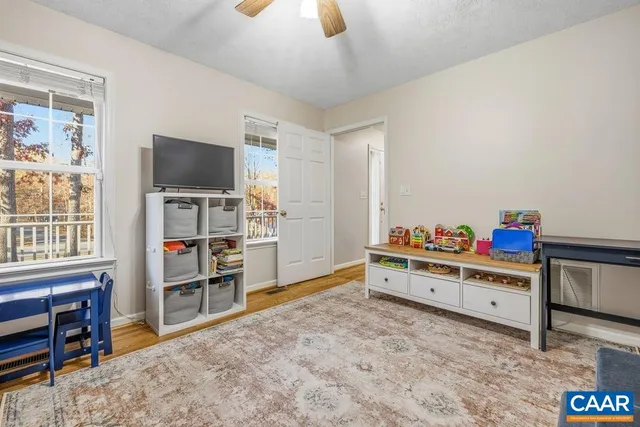 a room with furniture and a flat screen tv