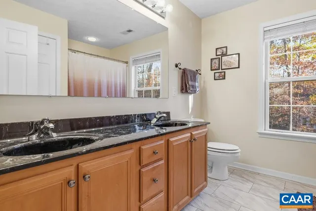 a kitchen with stainless steel appliances a sink a stove and a window