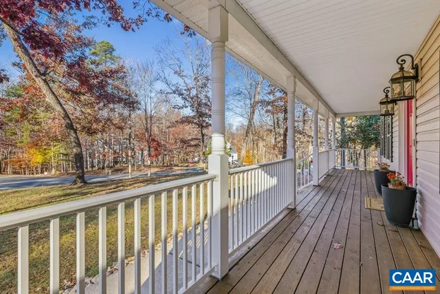 a view of a balcony with wooden floor