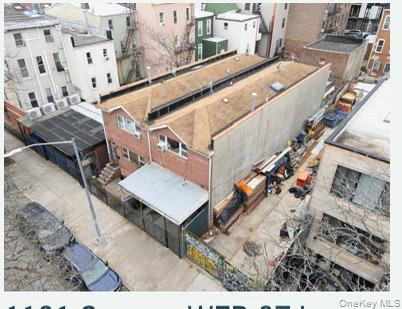 1101 Greene Avenue Brooklyn, NY 11221 - Photo 7 of 14 a aerial view of a residential apartment building with a yard