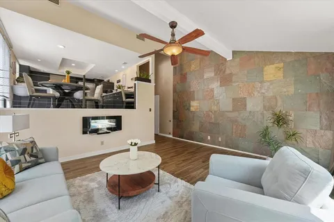 a living room with furniture and a rug