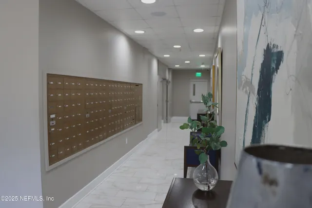 a view of a kitchen with a dining table and chairs