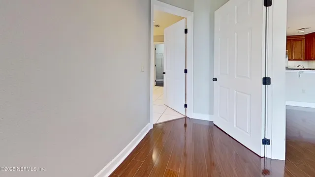 an empty room with wooden floor