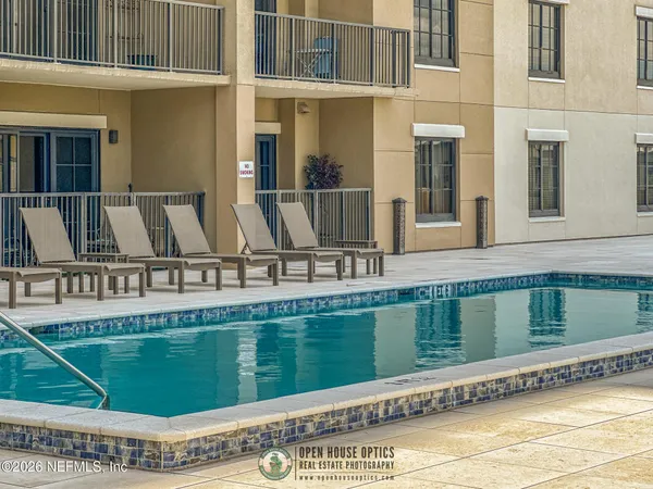a view of a swimming pool with a sitting space