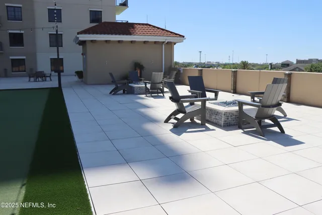 a view of a terrace with furniture