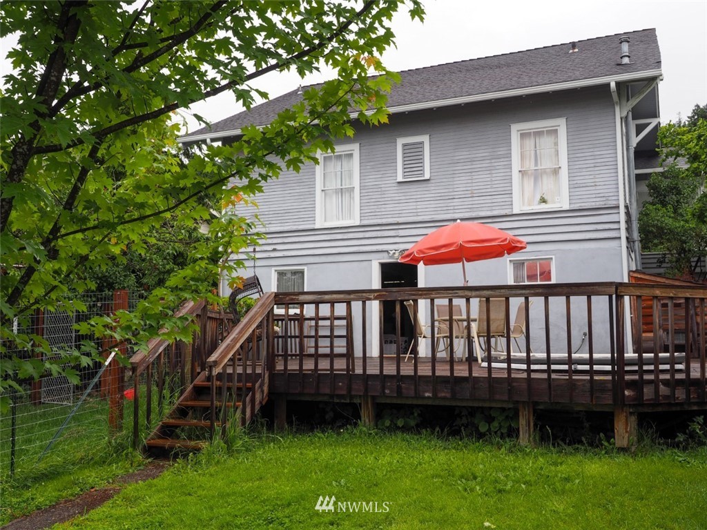 245 Southeast Washington Avenue Chehalis, WA 98532 - Photo 6 of 21 a view of a house with a yard and deck