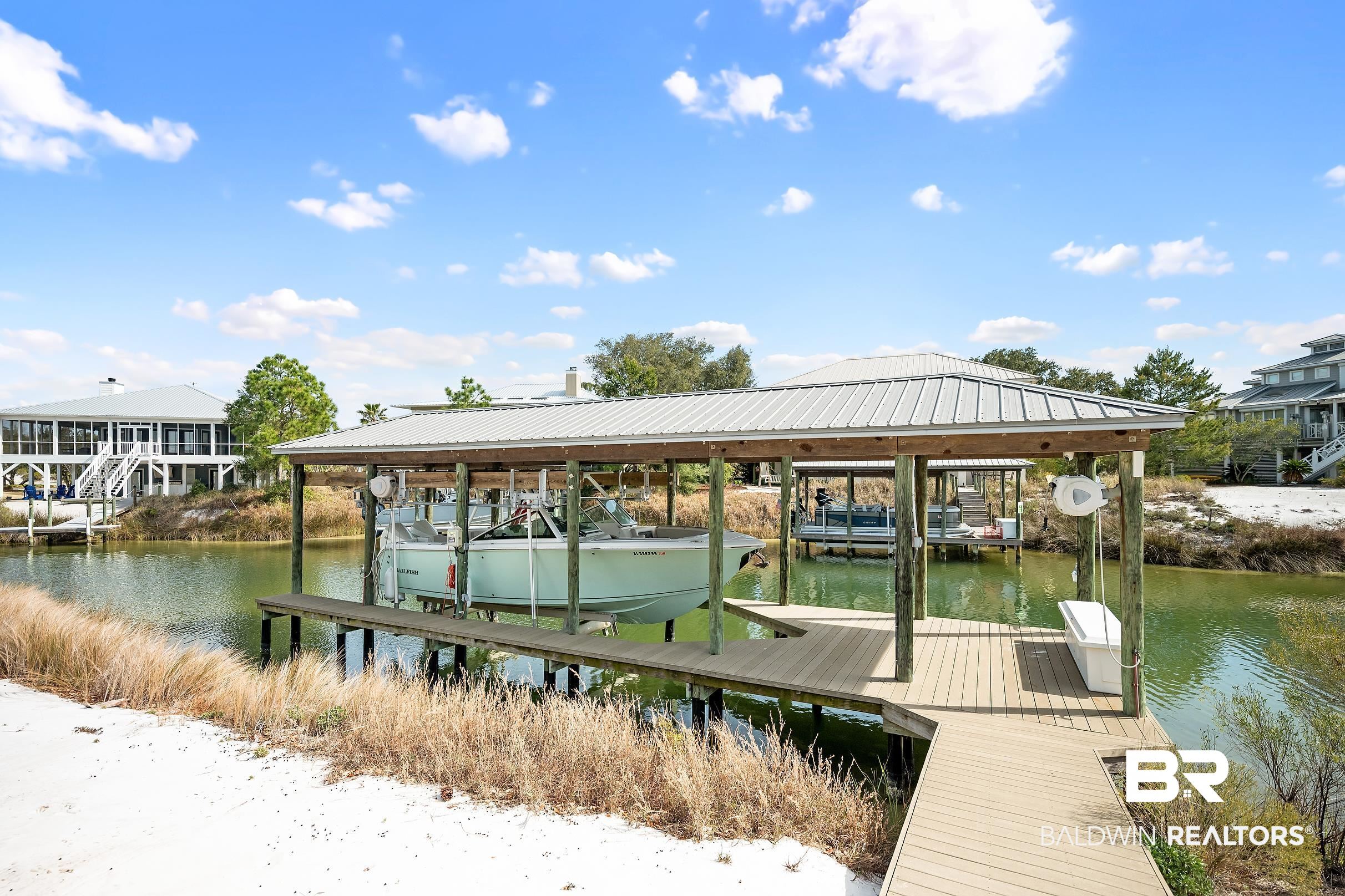 33186 Marlin Key Drive Orange Beach, AL 36561 - Photo 18 of 87 Dock featuring boat lift and a water view
