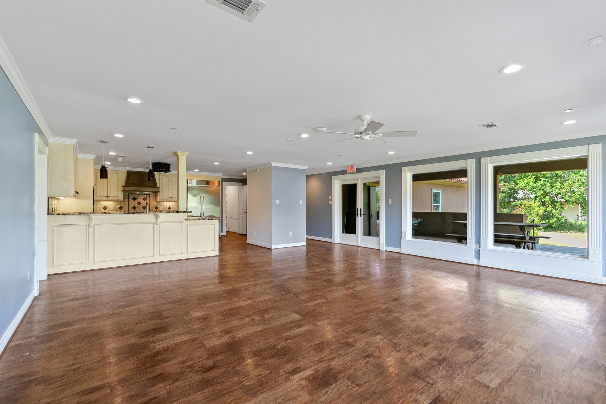 17018 Grant Road Cypress, TX 77429 - Photo 12 of 50 a view of an empty room with kitchen and a window